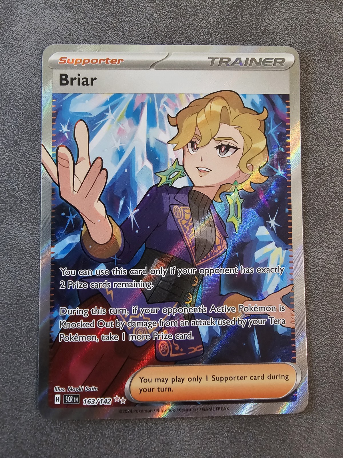 Briar Ultra Rare Holo SV07: Stellar Crown 163/142 NM Near Mint Naoku Saito