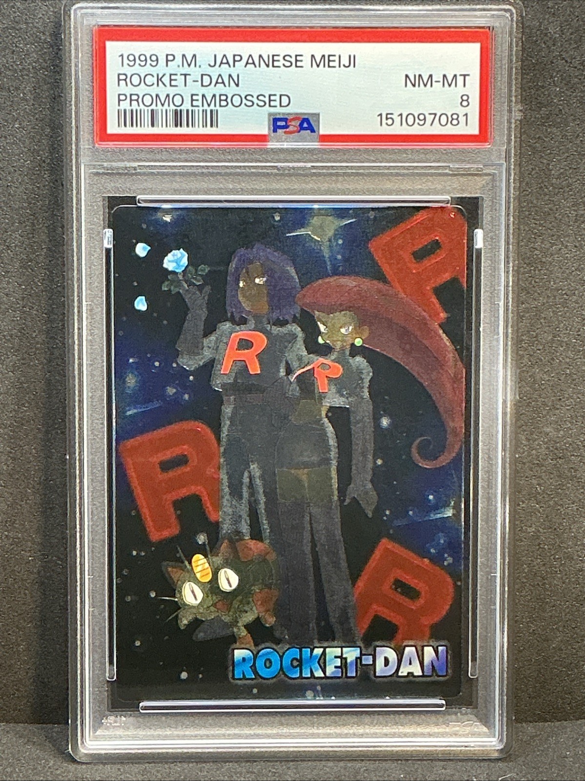 Rocket Dan Team Rocket 1999 Pokemon Japanese Meiji Promo (Embossed) PSA 8 Clean
