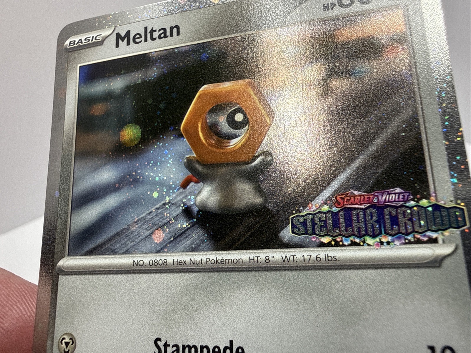 Pokémon – Meltan STAMPED COSMOS HOLO 102/142 – Stellar CROWN SWIRL