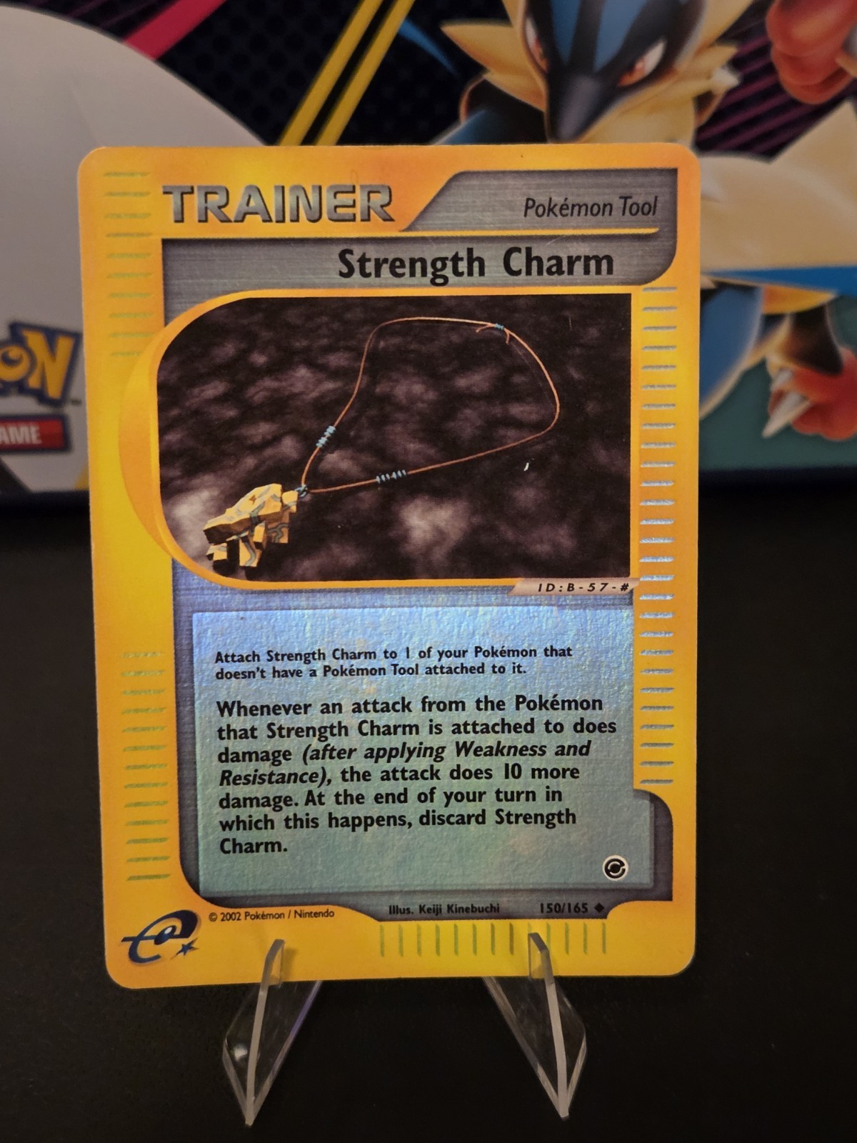 Strength Charm 150/165 Expedition Base Set Reverse Holo
