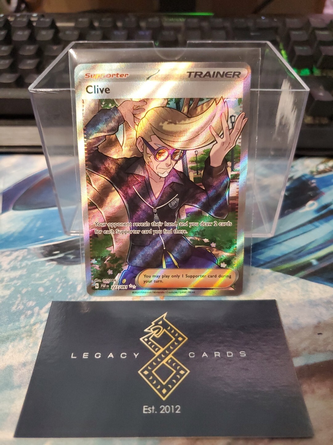 Clive 227/091 – Paldean Fates Ultra Rare – Pokémon TCG (NM)