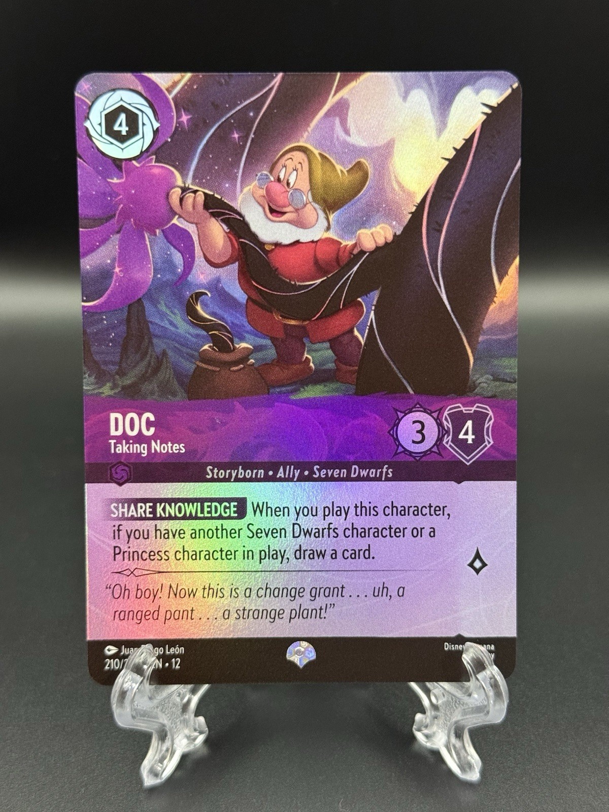 Doc – Taking Notes (Epic) 210/204 Epic Wilds Unknown Lorcana Holo Near Mint