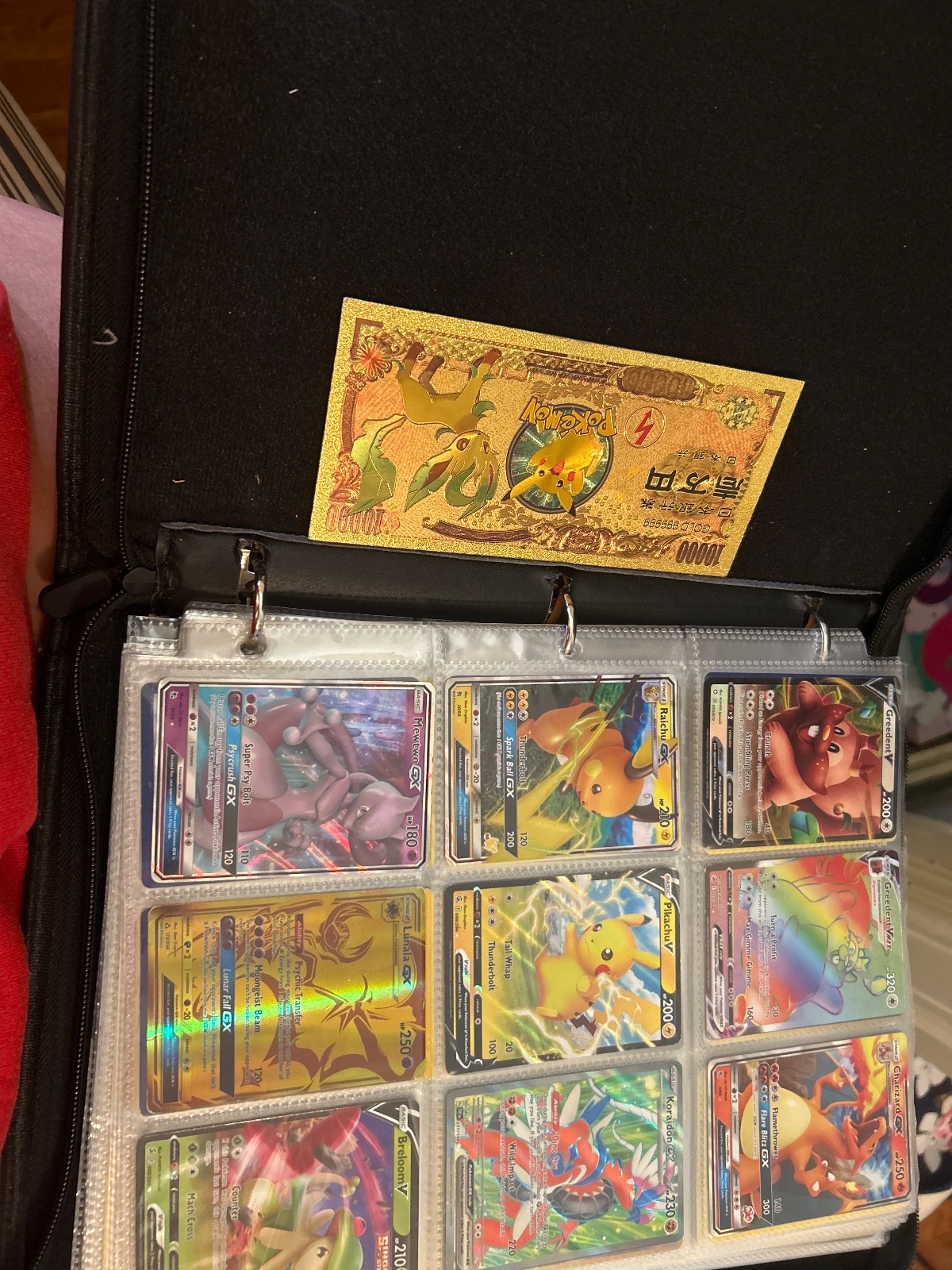 Rare and common pokemon cards with organizer