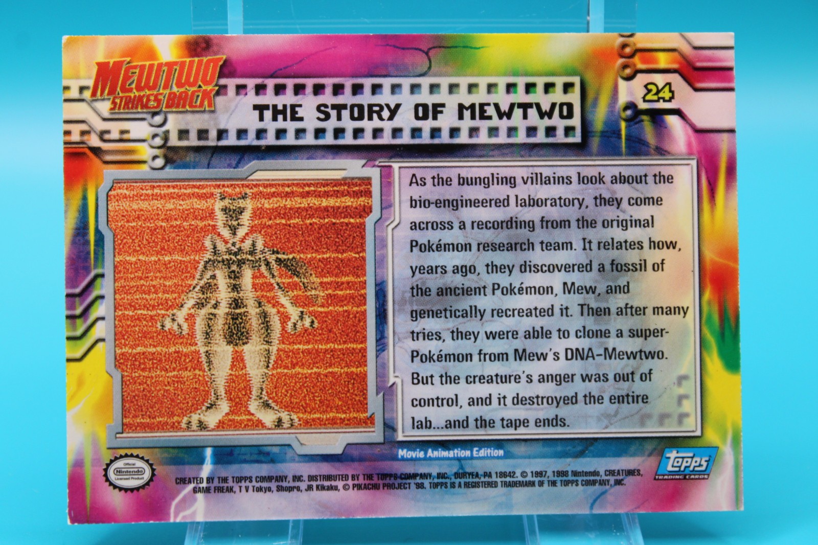Pokemon MewTwo Strikes Back #24 The Story Of MewTwo Topps Blue Logo Foil Holo
