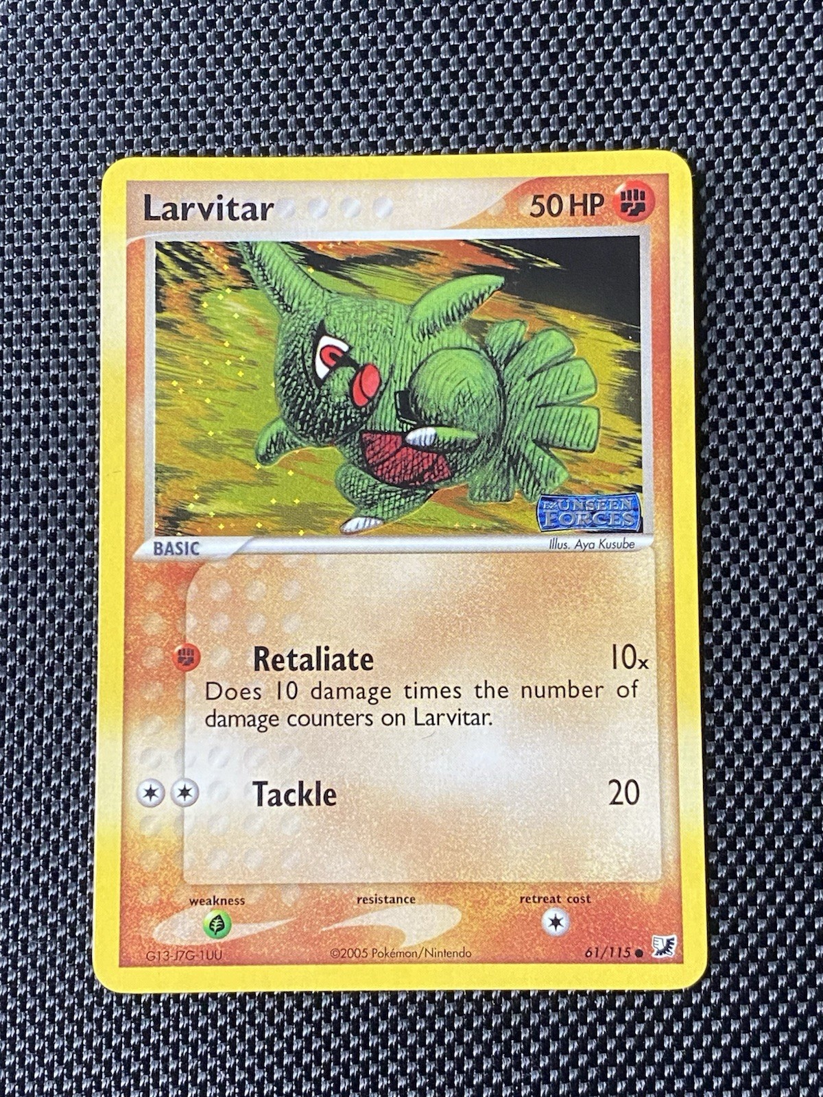 Larvitar 61/115 Unseen Forces (Stamped) Reverse Holo LP+