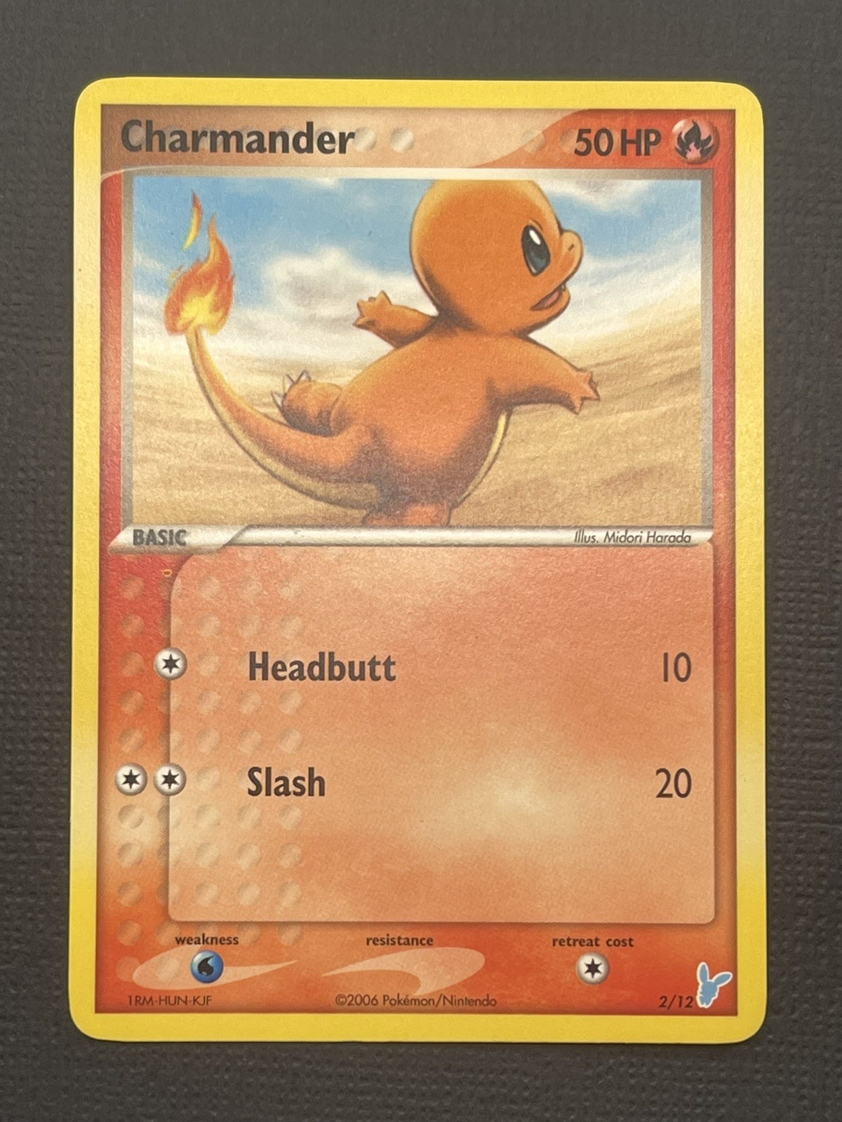 Charmander 2/12 EX Trainer Kit 2 Minun Pokemon Light play LP/NM ( 58/112 )