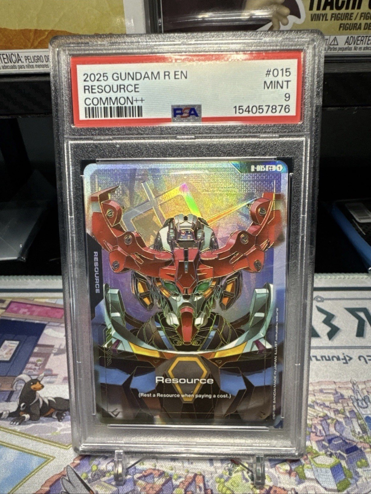 2025 Gundam R EN Resource 015 Common++ Holo Gundam War TCG Gundam PSA 9