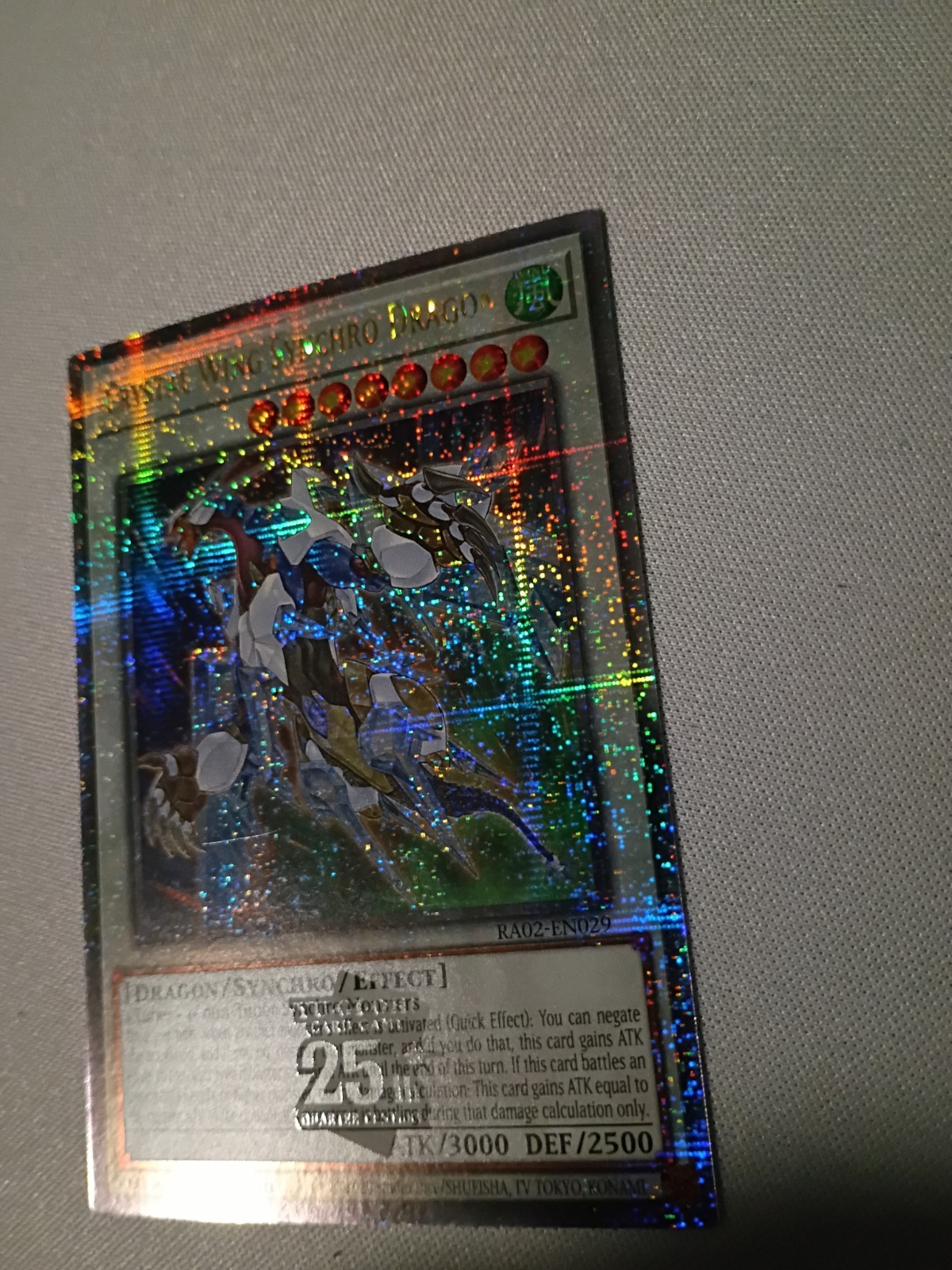 Crystal Wing Synchro Dragon (Quarter Century Secret Rare) RA02-EN029 Yu-Gi-Oh NM