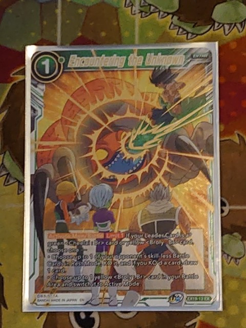 Dragon Ball Super TCG – EX19-13 EX – Encountering The Unknown Gold Foil Mint