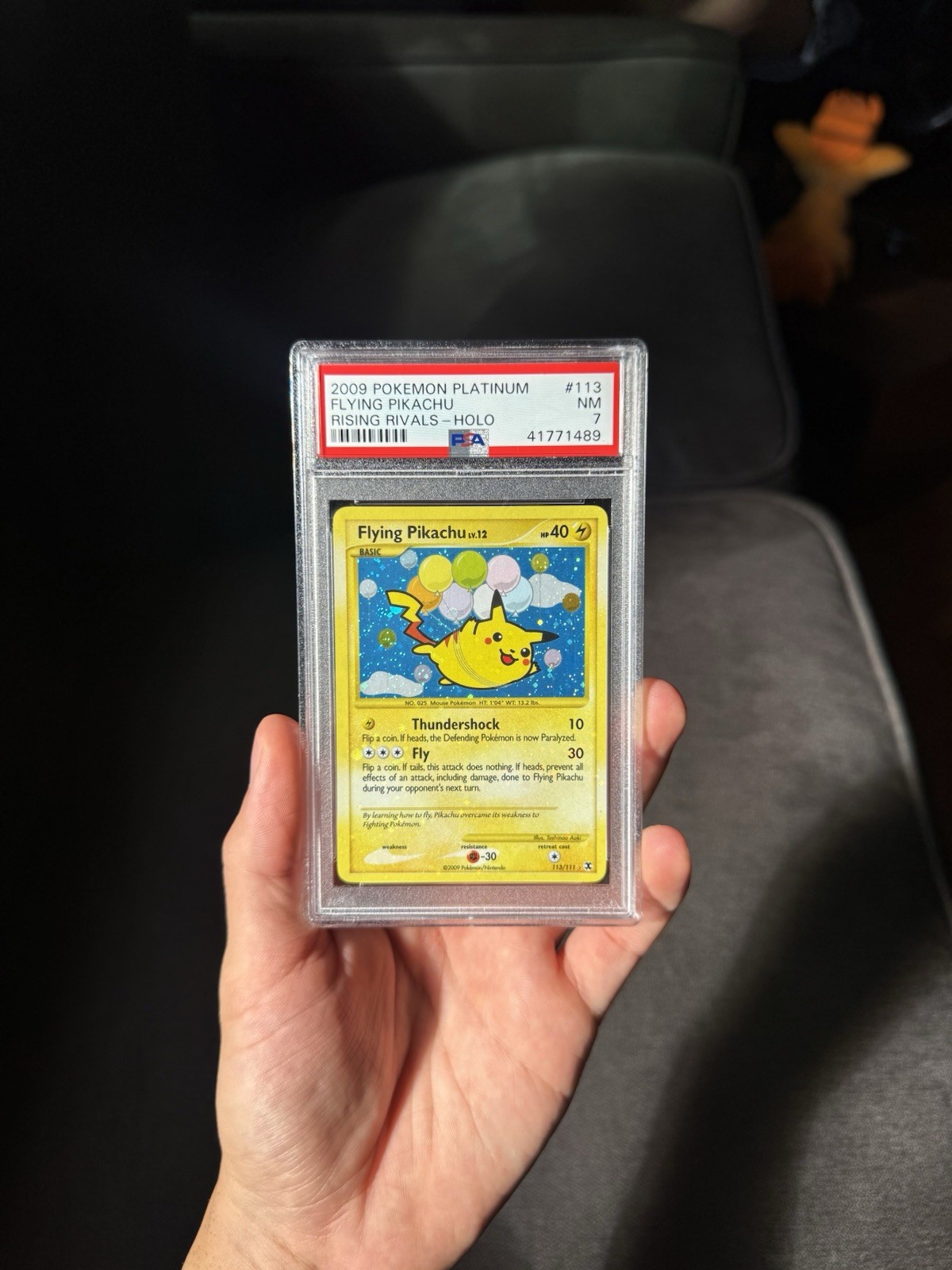 Pokémon Flying Pikachu 113/111 Holo Bleed Swirl PSA 7 Rising Rivals