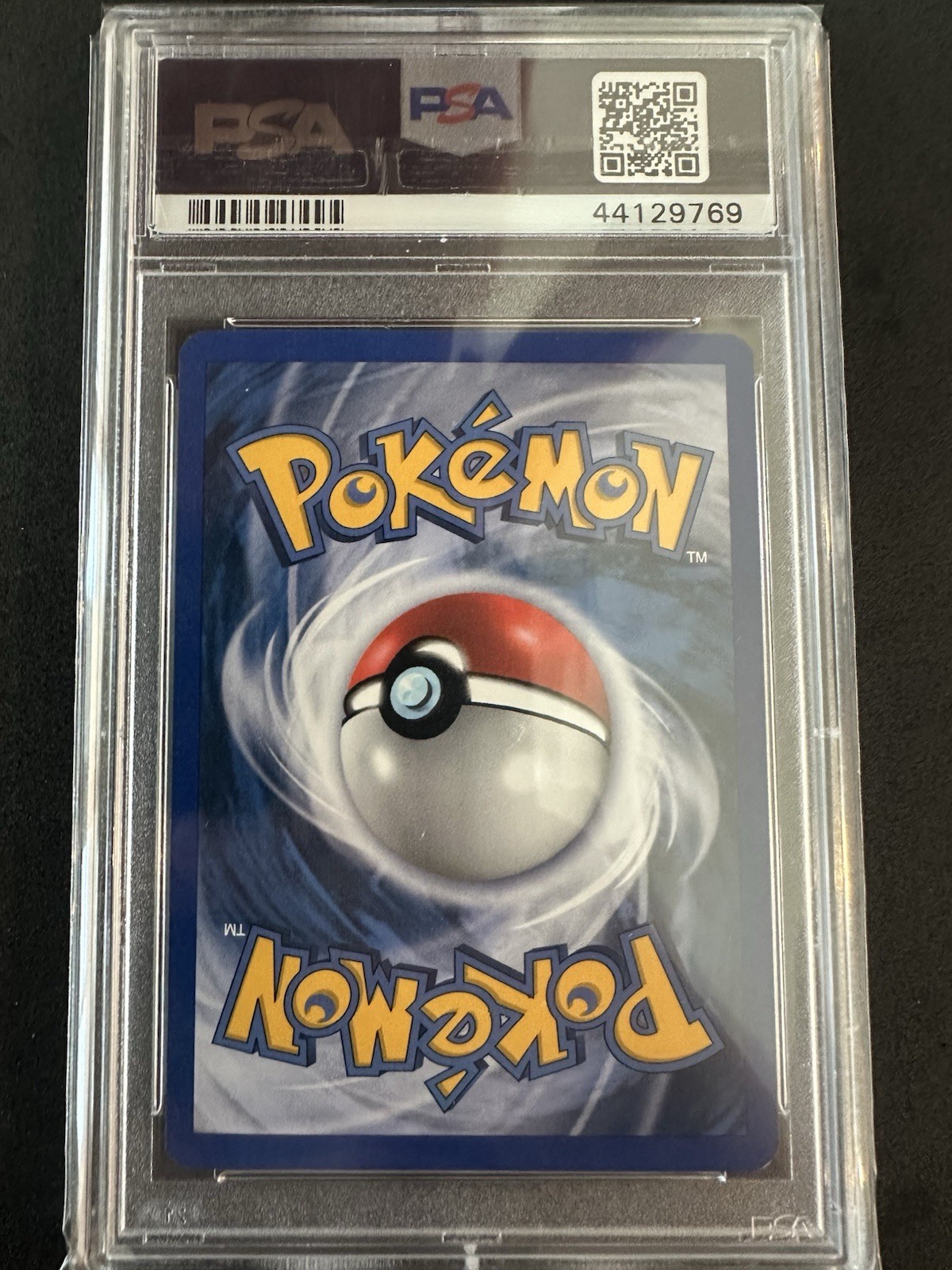 Larvitar 52/106 Emerald Reverse Holo PSA 9