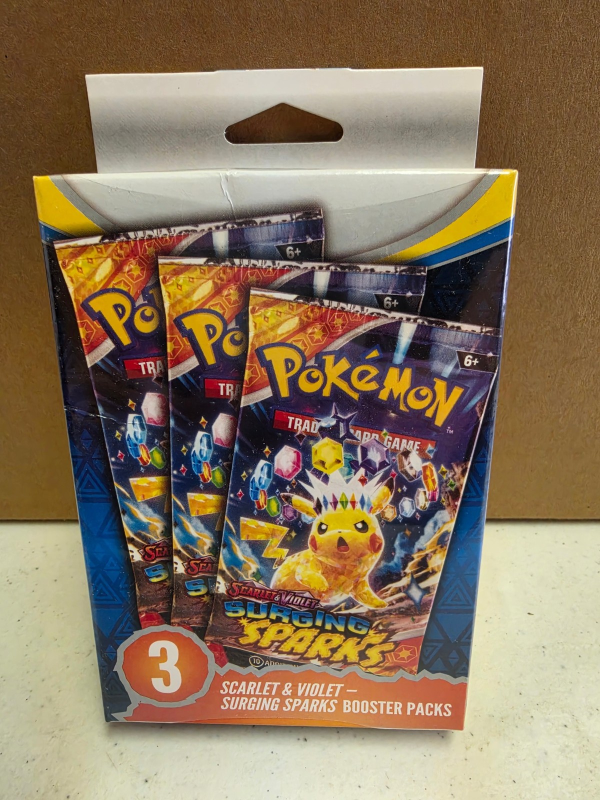 Pokemon TCG Surging Sparks Booster 3-Pack Hanger Box Sealed
