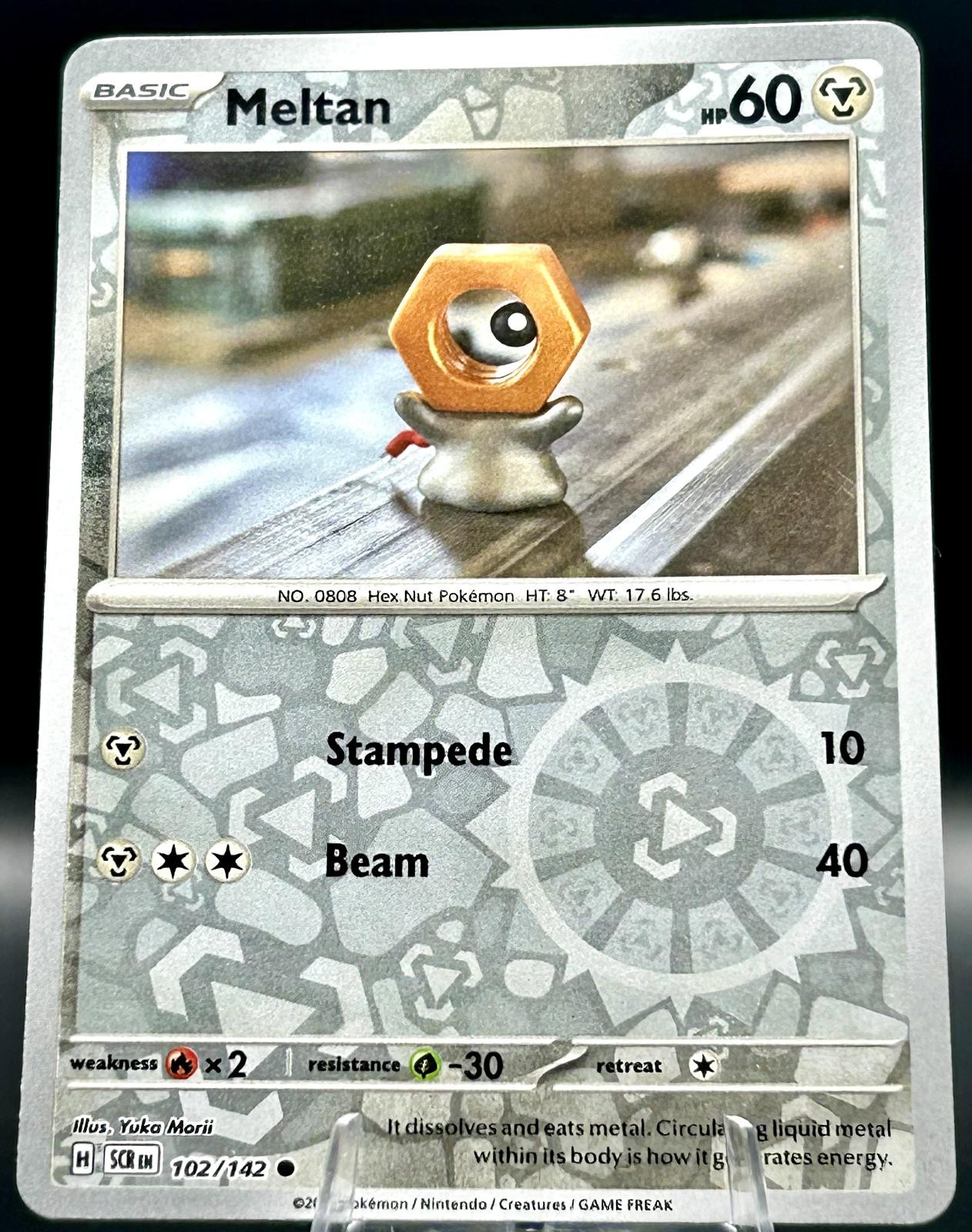 Meltan 102/142 Common Stellar Crown Pokemon TCG Reverse Holo Near Mint