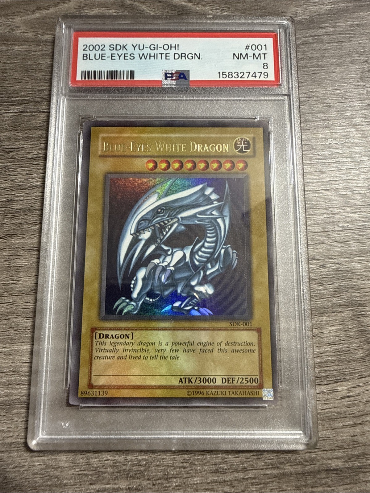 2002 Yu-Gi-Oh! SDK-001 Blue-Eyes White Dragon PSA 8 NM-MT Starter Deck Kaiba