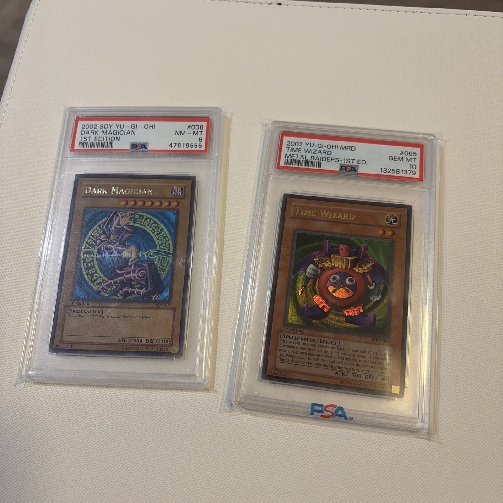 Time Wizard PSA 10 2002 MRD 1st Edition and Dark Magician Sdy 1st edition PSA 8